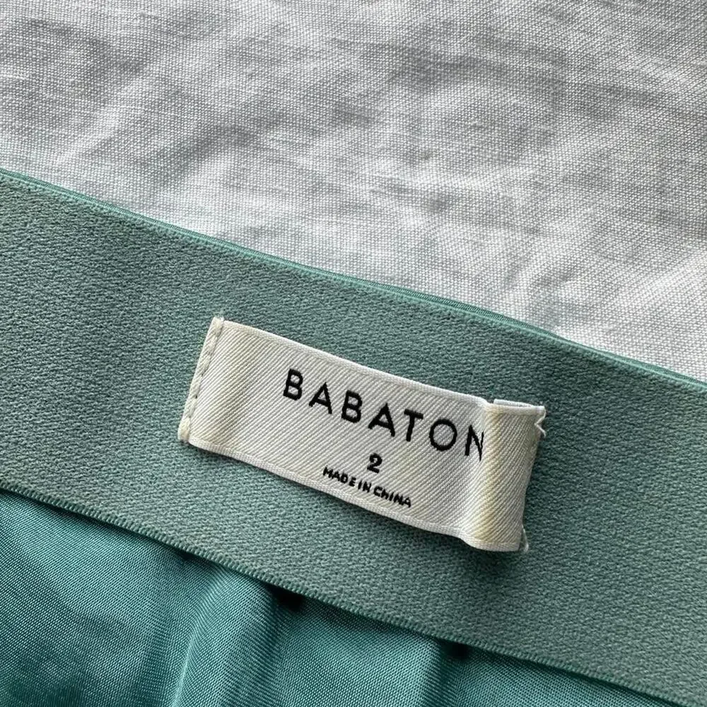 Green satin mini skirt in
